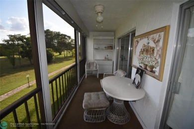 Discover convenience, and scenic beauty in this lovely 2-bedroom on Inverrary Country Club in Florida - for sale on GolfHomes.com, golf home, golf lot
