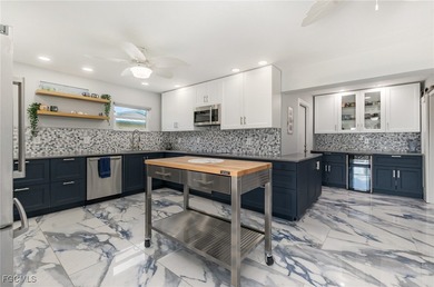 DISCOVER THE WATERFRONT LIFESTYLE YOU'VE BEEN DREAMING OF on El Rio Golf Course and Club in Florida - for sale on GolfHomes.com, golf home, golf lot