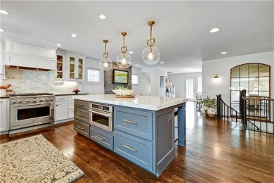Wake up each day to the peaceful beauty of Lake Quivira in this on Lake Quivira Country Club in Kansas - for sale on GolfHomes.com, golf home, golf lot