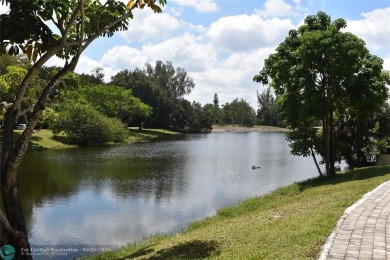 Discover convenience, and scenic beauty in this lovely 2-bedroom on Inverrary Country Club in Florida - for sale on GolfHomes.com, golf home, golf lot