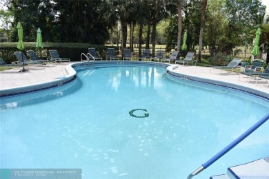 Discover convenience, and scenic beauty in this lovely 2-bedroom on Inverrary Country Club in Florida - for sale on GolfHomes.com, golf home, golf lot