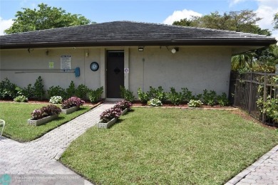 Discover convenience, and scenic beauty in this lovely 2-bedroom on Inverrary Country Club in Florida - for sale on GolfHomes.com, golf home, golf lot