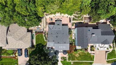 Wake up each day to the peaceful beauty of Lake Quivira in this on Lake Quivira Country Club in Kansas - for sale on GolfHomes.com, golf home, golf lot