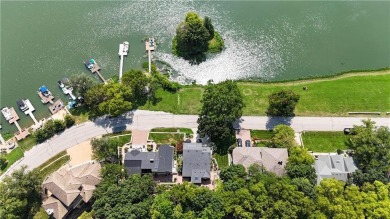 Wake up each day to the peaceful beauty of Lake Quivira in this on Lake Quivira Country Club in Kansas - for sale on GolfHomes.com, golf home, golf lot