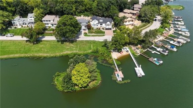 Wake up each day to the peaceful beauty of Lake Quivira in this on Lake Quivira Country Club in Kansas - for sale on GolfHomes.com, golf home, golf lot
