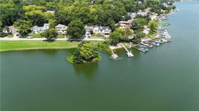Wake up each day to the peaceful beauty of Lake Quivira in this on Lake Quivira Country Club in Kansas - for sale on GolfHomes.com, golf home, golf lot