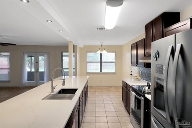 Located in the heart of Tiger Point, this 4-bedroom, 2-bath home on Tiger Point Golf and Country Club in Florida - for sale on GolfHomes.com, golf home, golf lot