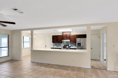 Located in the heart of Tiger Point, this 4-bedroom, 2-bath home on Tiger Point Golf and Country Club in Florida - for sale on GolfHomes.com, golf home, golf lot