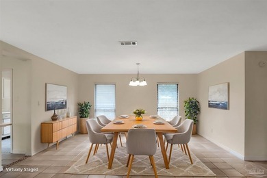 Located in the heart of Tiger Point, this 4-bedroom, 2-bath home on Tiger Point Golf and Country Club in Florida - for sale on GolfHomes.com, golf home, golf lot