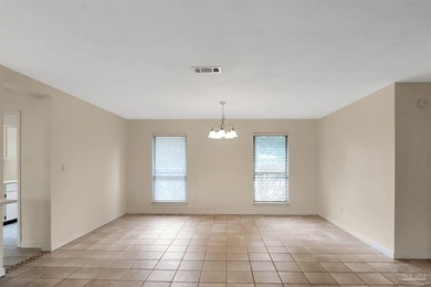 Located in the heart of Tiger Point, this 4-bedroom, 2-bath home on Tiger Point Golf and Country Club in Florida - for sale on GolfHomes.com, golf home, golf lot