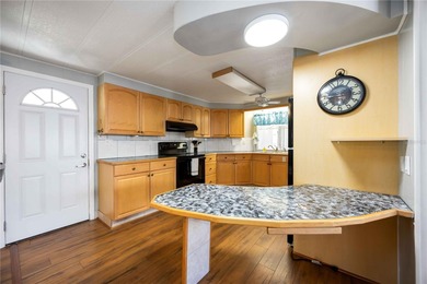 Seller is offering $10,000 to the new buyer for their shares on Twin Isles Country Club in Florida - for sale on GolfHomes.com, golf home, golf lot