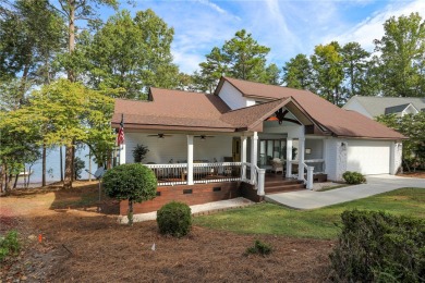 This stunning property embodies the essence of lakefront living on The Trail At Chickasaw Pointe in South Carolina - for sale on GolfHomes.com, golf home, golf lot