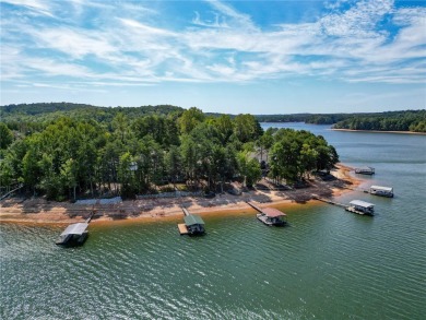 This stunning property embodies the essence of lakefront living on The Trail At Chickasaw Pointe in South Carolina - for sale on GolfHomes.com, golf home, golf lot