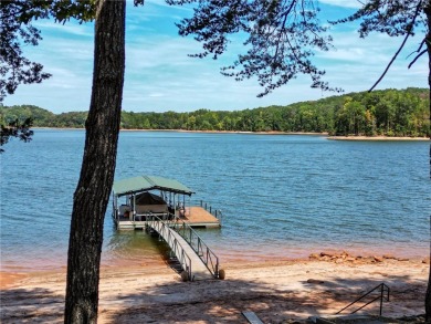 This stunning property embodies the essence of lakefront living on The Trail At Chickasaw Pointe in South Carolina - for sale on GolfHomes.com, golf home, golf lot