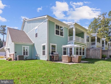 Welcome to 22179 Dune Circle, a stunning end-unit townhome in on The Peninsula Golf and Country Club in Delaware - for sale on GolfHomes.com, golf home, golf lot