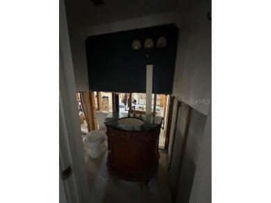 Opportunity for cash buyer! House flooded in Helene, everything on Gulf Harbors Golf Course in Florida - for sale on GolfHomes.com, golf home, golf lot