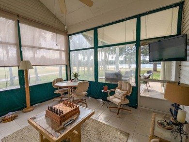 Beautiful lake and golf course views from this custom model home on The Great Outdoors Golf and Country Club in Florida - for sale on GolfHomes.com, golf home, golf lot