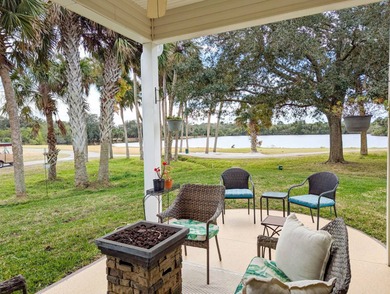 Beautiful lake and golf course views from this custom model home on The Great Outdoors Golf and Country Club in Florida - for sale on GolfHomes.com, golf home, golf lot