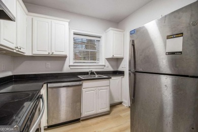 Unbeatable value for a 2BR condo inside the perimeter in this on Alfred Tup Holmes Golf Course in Georgia - for sale on GolfHomes.com, golf home, golf lot