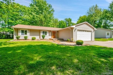 Charming ranch home on 2.58 acres in a peaceful country setting on Lyon Oaks Golf Course in Michigan - for sale on GolfHomes.com, golf home, golf lot
