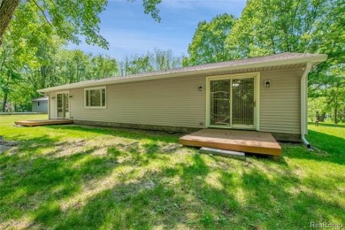 Charming ranch home on 2.58 acres in a peaceful country setting on Lyon Oaks Golf Course in Michigan - for sale on GolfHomes.com, golf home, golf lot