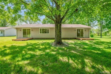 Charming ranch home on 2.58 acres in a peaceful country setting on Lyon Oaks Golf Course in Michigan - for sale on GolfHomes.com, golf home, golf lot