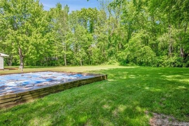 Charming ranch home on 2.58 acres in a peaceful country setting on Lyon Oaks Golf Course in Michigan - for sale on GolfHomes.com, golf home, golf lot