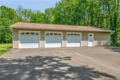 Charming ranch home on 2.58 acres in a peaceful country setting on Lyon Oaks Golf Course in Michigan - for sale on GolfHomes.com, golf home, golf lot