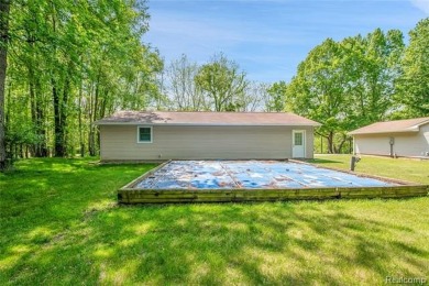 Charming ranch home on 2.58 acres in a peaceful country setting on Lyon Oaks Golf Course in Michigan - for sale on GolfHomes.com, golf home, golf lot