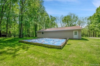 Charming ranch home on 2.58 acres in a peaceful country setting on Lyon Oaks Golf Course in Michigan - for sale on GolfHomes.com, golf home, golf lot