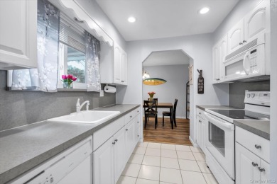 This charming two-bedroom, one-bath Condo exemplifies easy on Holbrook Country Club Golf Course in New York - for sale on GolfHomes.com, golf home, golf lot