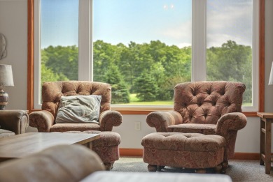 Escape to your perfect vacation retreat in Scenic North Village! on Crystal Mountain Golf Course in Michigan - for sale on GolfHomes.com, golf home, golf lot