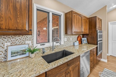 Sprawling brick ranch in the highly coveted Hawkstone on Eaton Country Club in Colorado - for sale on GolfHomes.com, golf home, golf lot