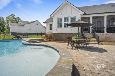 This gold fortified white painted concrete board home in the on Lakewood Golf Club in Alabama - for sale on GolfHomes.com, golf home, golf lot