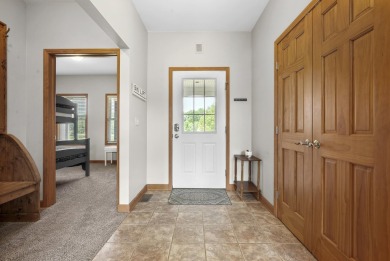 Escape to your perfect vacation retreat in Scenic North Village! on Crystal Mountain Golf Course in Michigan - for sale on GolfHomes.com, golf home, golf lot
