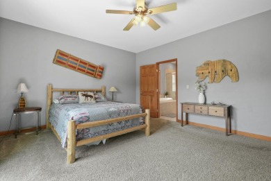 Escape to your perfect vacation retreat in Scenic North Village! on Crystal Mountain Golf Course in Michigan - for sale on GolfHomes.com, golf home, golf lot
