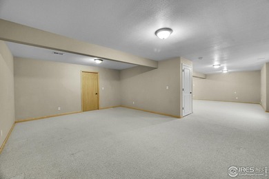 Sprawling brick ranch in the highly coveted Hawkstone on Eaton Country Club in Colorado - for sale on GolfHomes.com, golf home, golf lot