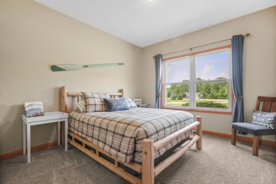 Escape to your perfect vacation retreat in Scenic North Village! on Crystal Mountain Golf Course in Michigan - for sale on GolfHomes.com, golf home, golf lot