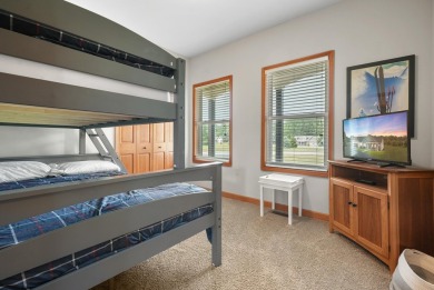 Escape to your perfect vacation retreat in Scenic North Village! on Crystal Mountain Golf Course in Michigan - for sale on GolfHomes.com, golf home, golf lot