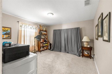 One or more photos have been virtually staged.  Stonecrest is a on Stonecrest Golf and Club Club in Florida - for sale on GolfHomes.com, golf home, golf lot