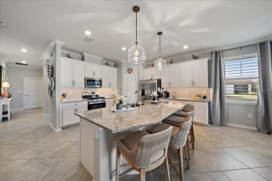 Live in Luxury in this spacious 2 Bedroom + Den single-story on Esplanade Golf and Country at Lakewood Ranch in Florida - for sale on GolfHomes.com, golf home, golf lot