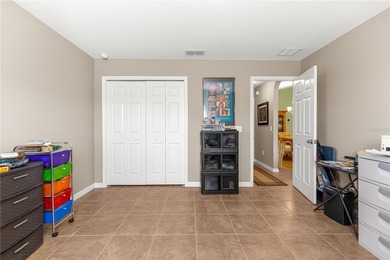 One or more photos have been virtually staged.  Stonecrest is a on Stonecrest Golf and Club Club in Florida - for sale on GolfHomes.com, golf home, golf lot