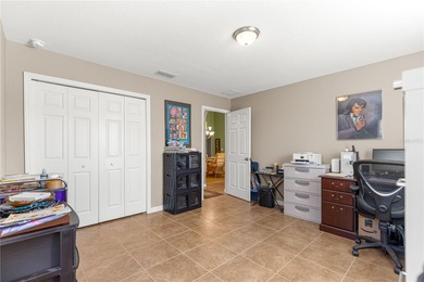 One or more photos have been virtually staged.  Stonecrest is a on Stonecrest Golf and Club Club in Florida - for sale on GolfHomes.com, golf home, golf lot