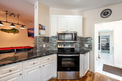Impeccably maintained, DiVosta-built POOL home in Cypress Lake! on Monarch Country Club in Florida - for sale on GolfHomes.com, golf home, golf lot