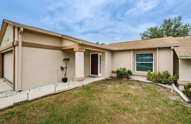 AFFORDABLE HOME IN THE HEART OF SPRING HILL ~ Welcome to this on Oak Hills Country Club in Florida - for sale on GolfHomes.com, golf home, golf lot