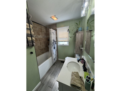 Large home located on an oversized lot in Captain's Cove on Captains Cove Golf and Yacht Club in Virginia - for sale on GolfHomes.com, golf home, golf lot