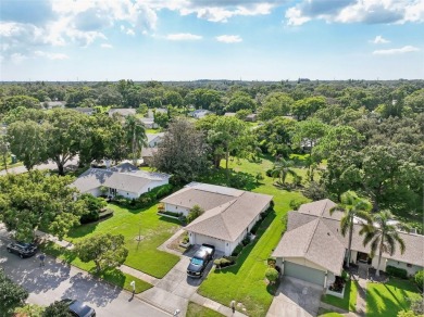 Nestled in the highly sought-after 55+ community of Highland on Highland Lakes Executive Golf Course in Florida - for sale on GolfHomes.com, golf home, golf lot