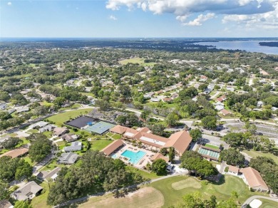 Nestled in the highly sought-after 55+ community of Highland on Highland Lakes Executive Golf Course in Florida - for sale on GolfHomes.com, golf home, golf lot