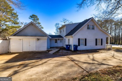 Welcome to this spacious and beautifully designed 5-bedroom on Canongate At Flat Creek Club in Georgia - for sale on GolfHomes.com, golf home, golf lot