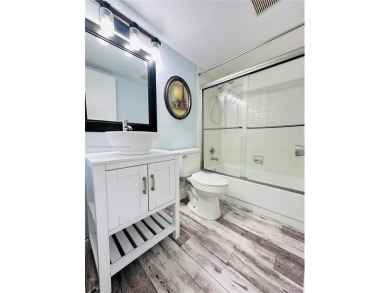 Bright and spacious corner unit in the desirable Century Village on Flamingo Lakes Country Club in Florida - for sale on GolfHomes.com, golf home, golf lot